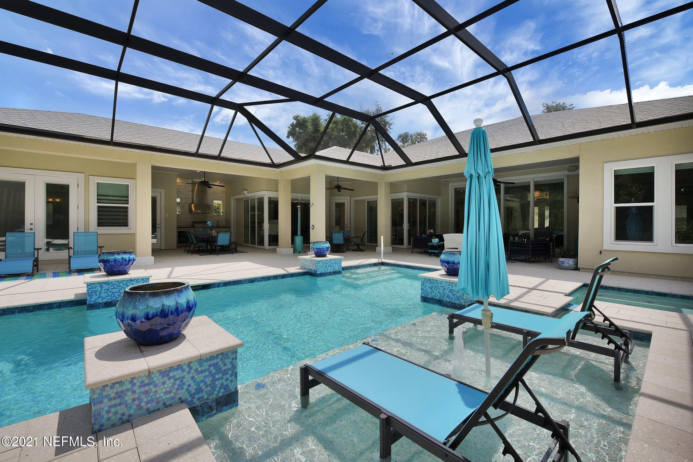 496 Costa Del Sol Drive St. Augustine, FL 32095 - Photo 93 of 111 a view of a house with backyard sitting area and porch