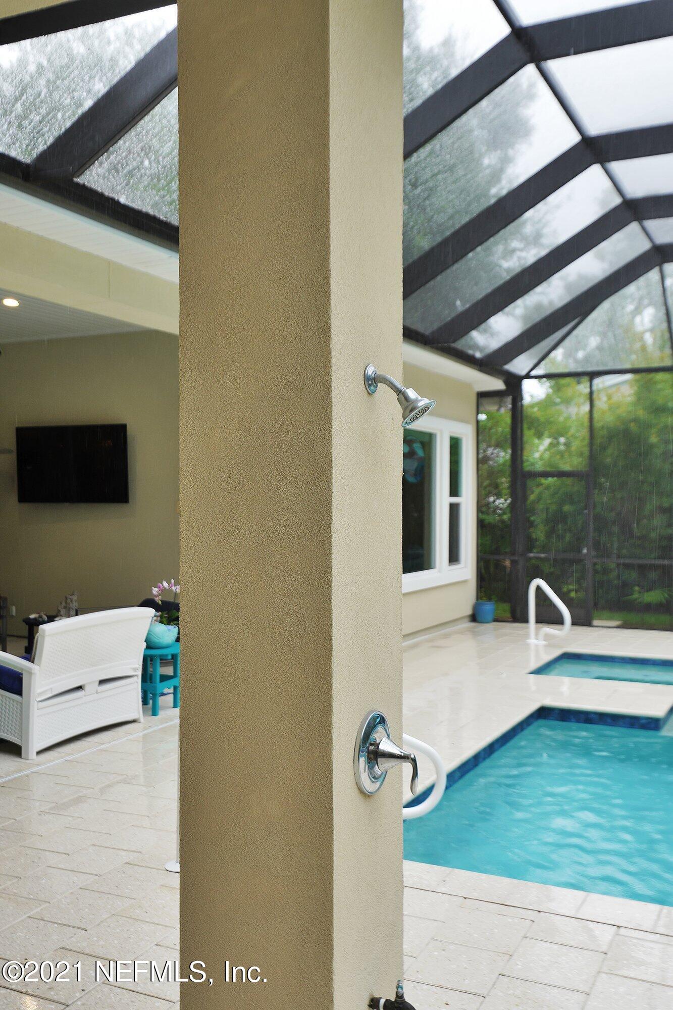 496 Costa Del Sol Drive St. Augustine, FL 32095 - Photo 97 of 111 a bathroom with a sink and a large window