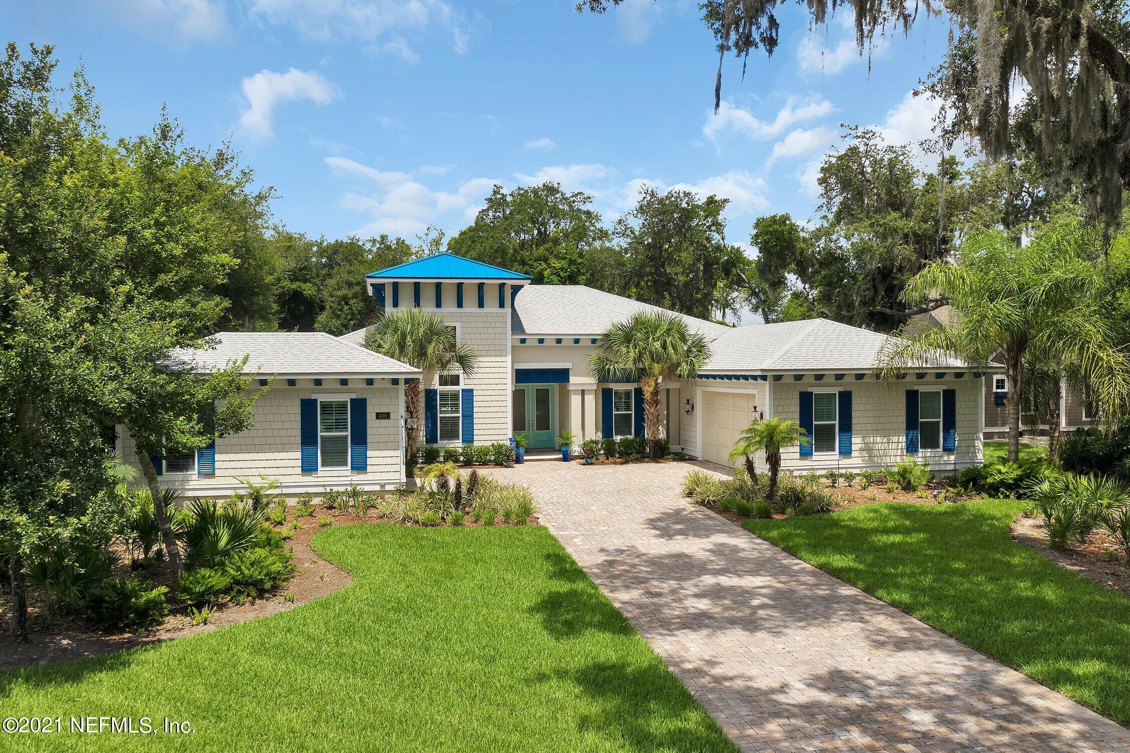 496 Costa Del Sol Drive St. Augustine, FL 32095 - Photo 100 of 111 a front view of a house with a garden