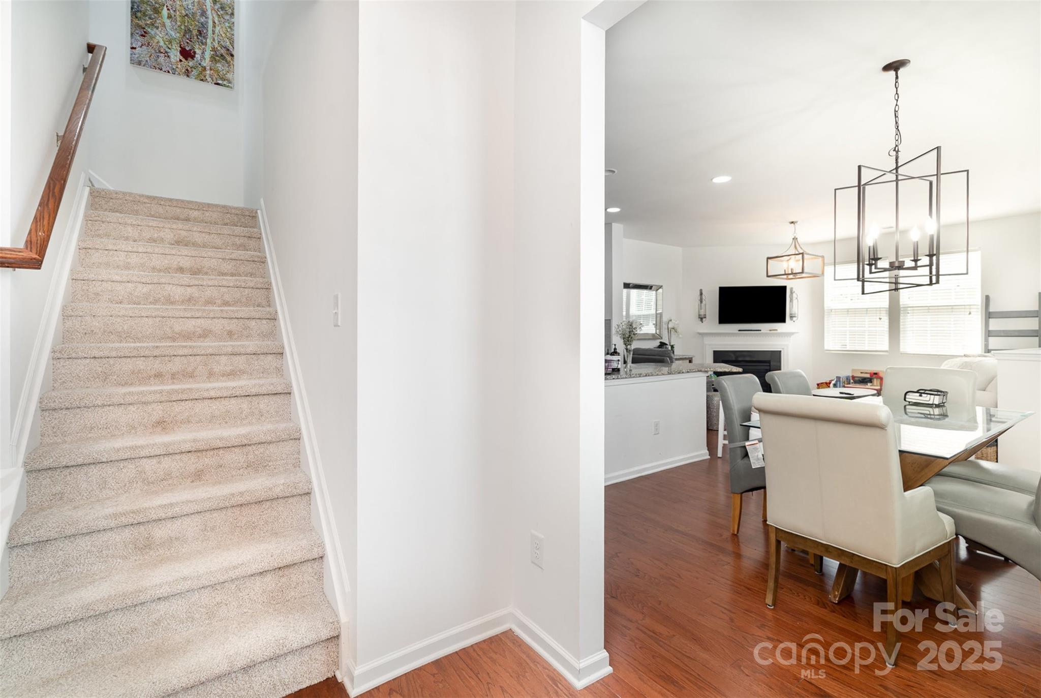 8245 Viewpoint Lane Cornelius, NC 28031 - Photo 3 of 32 a view of kitchen with furniture and wooden floor