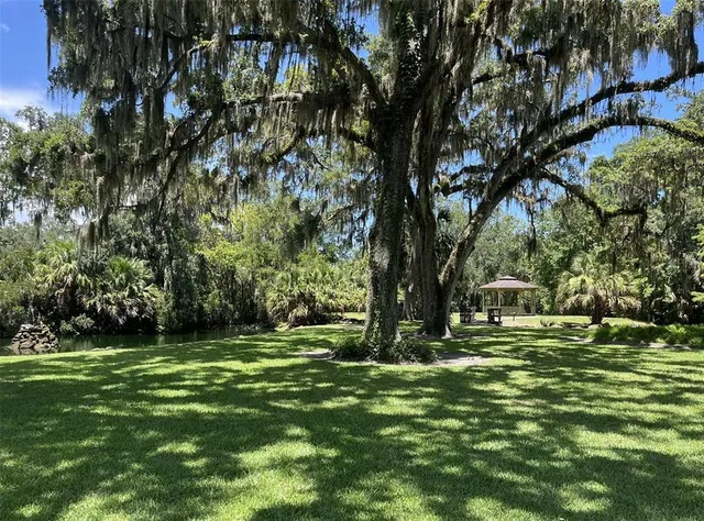 a view of a patio with chair and tables