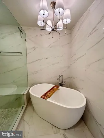 a bathroom with a sink a toilet and bathtub