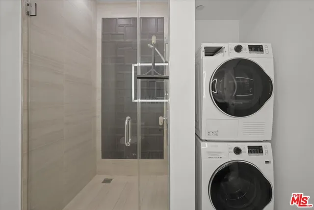 a view of livingroom with washer and dryer