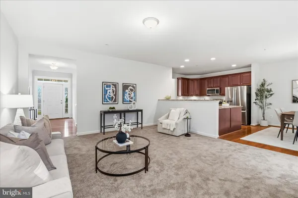 a living room with furniture and white walls