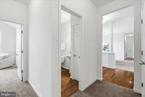 a view of a bathroom from the hallway