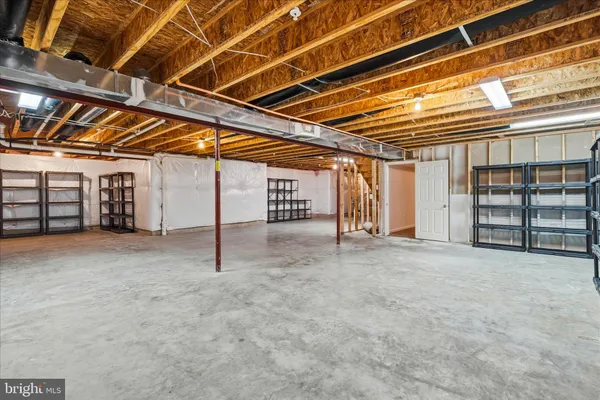 a view of a room with wooden ceiling