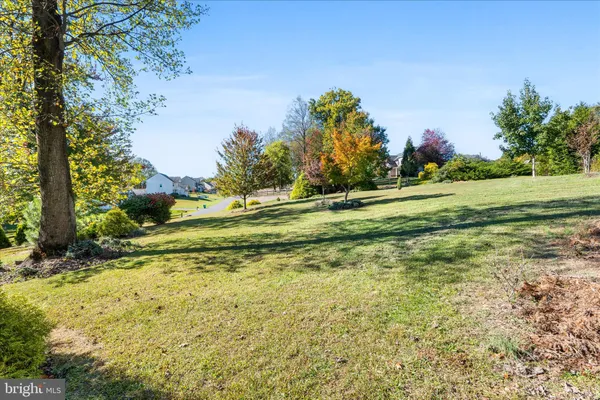 a view of a golf course with a house