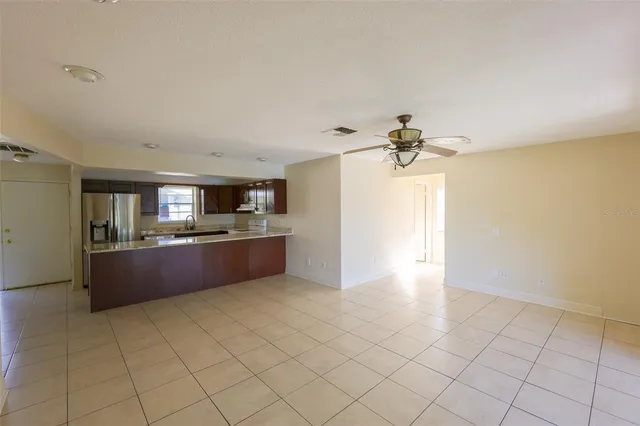 a kitchen with stainless steel appliances a refrigerator and microwave
