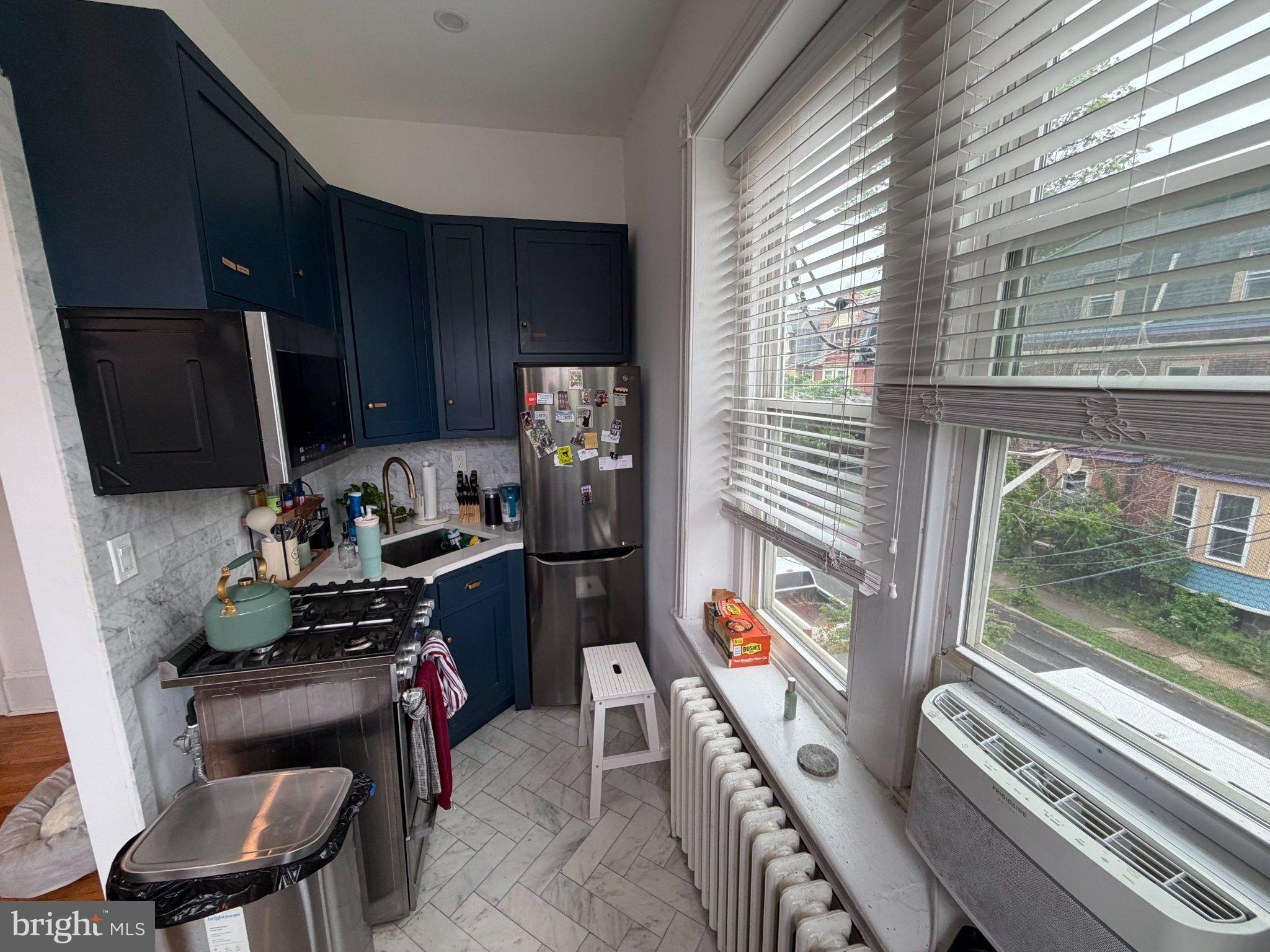 815 South 49th Street Philadelphia, PA 19143 - Photo 18 of 72 a room with furniture and a window