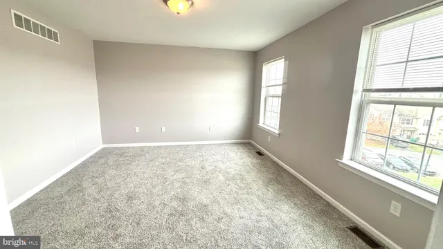 an empty room with windows