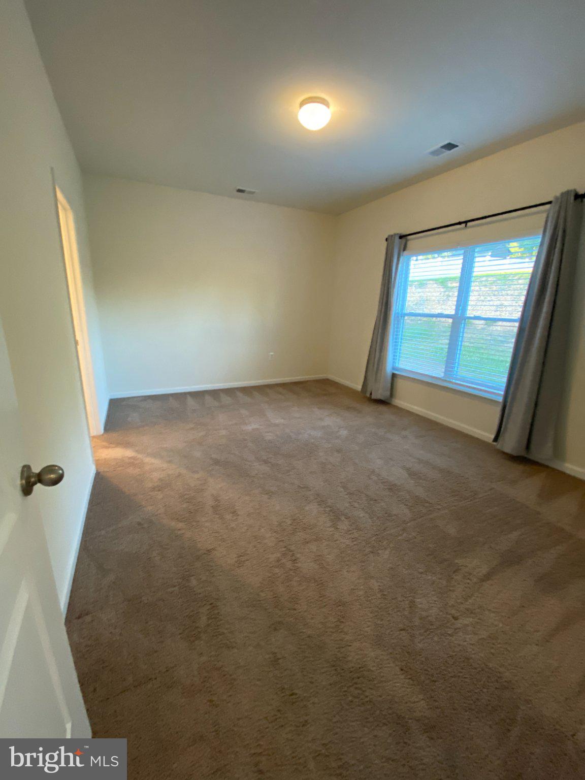697 Rivanna Run Falling Waters, WV 25419 - Photo 14 of 44 an empty room with windows