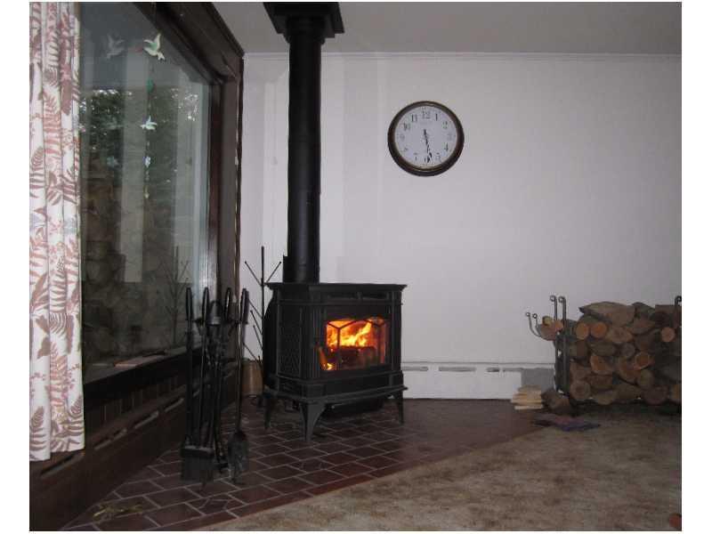 232 Cannon Hill Road Perry, ME 04667 - Photo 24 of 34 Other. Living room wood stove