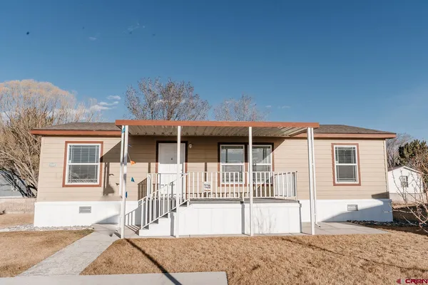 a front view of a house with a patio