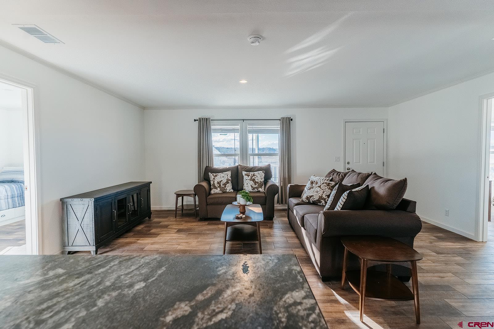 62650 Lasalle Road, Unit 820 Montrose, CO 81403 - Photo 12 of 29 a living room with furniture and a fireplace