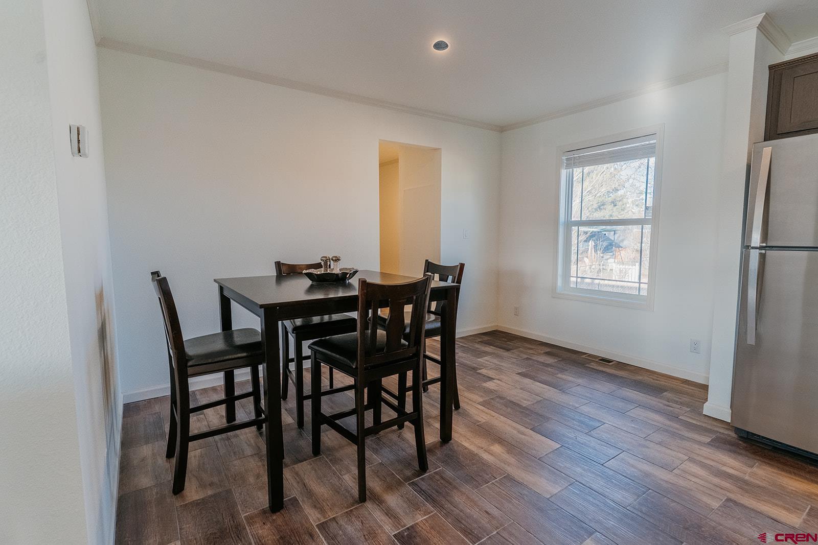 62650 Lasalle Road, Unit 820 Montrose, CO 81403 - Photo 16 of 29 a dining room with furniture and window