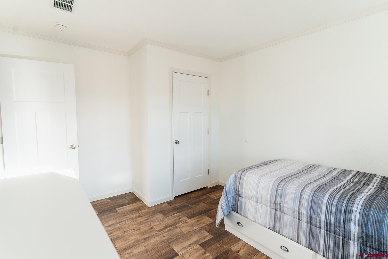 62650 Lasalle Road, Unit 820 Montrose, CO 81403 - Photo 25 of 29 a bedroom with a bed and pillows
