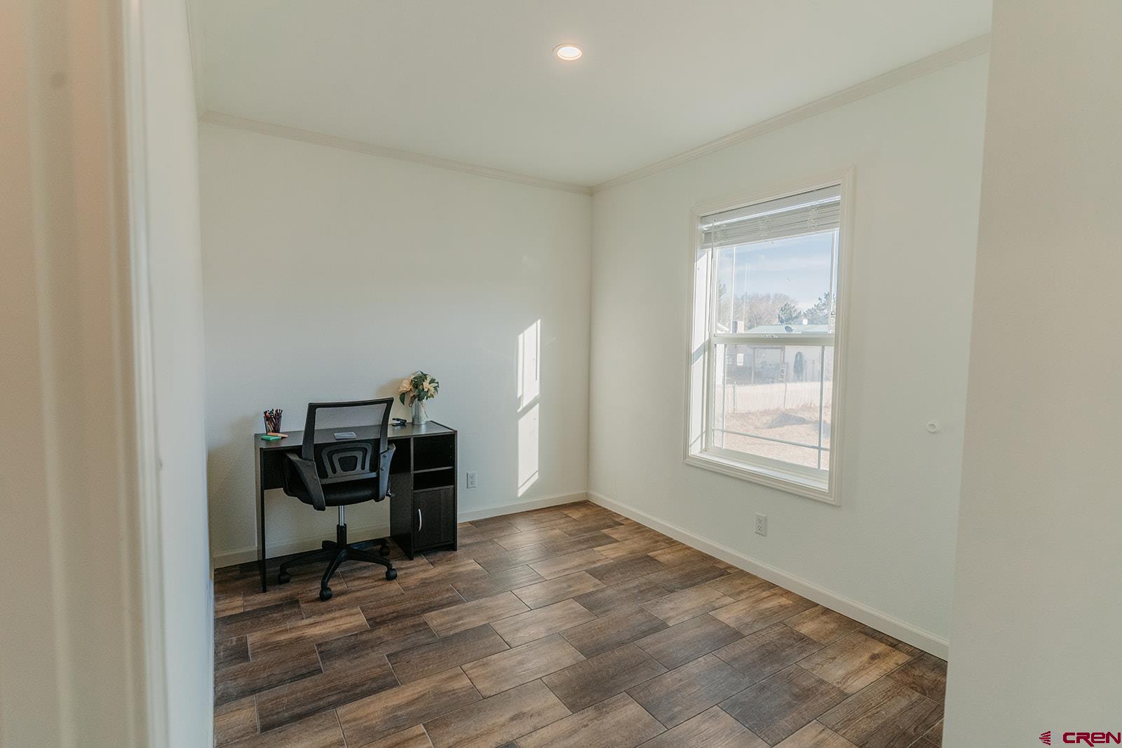 62650 Lasalle Road, Unit 820 Montrose, CO 81403 - Photo 27 of 29 a view of workspace with wooden floor and a window