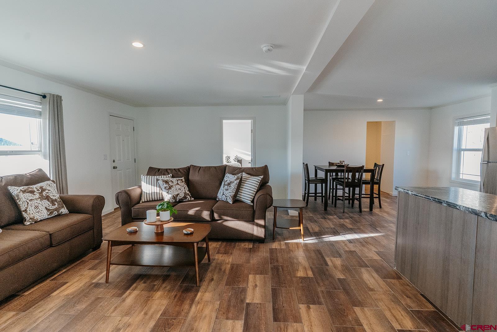 62650 Lasalle Road, Unit 820 Montrose, CO 81403 - Photo 29 of 29 a living room with furniture and wooden floor