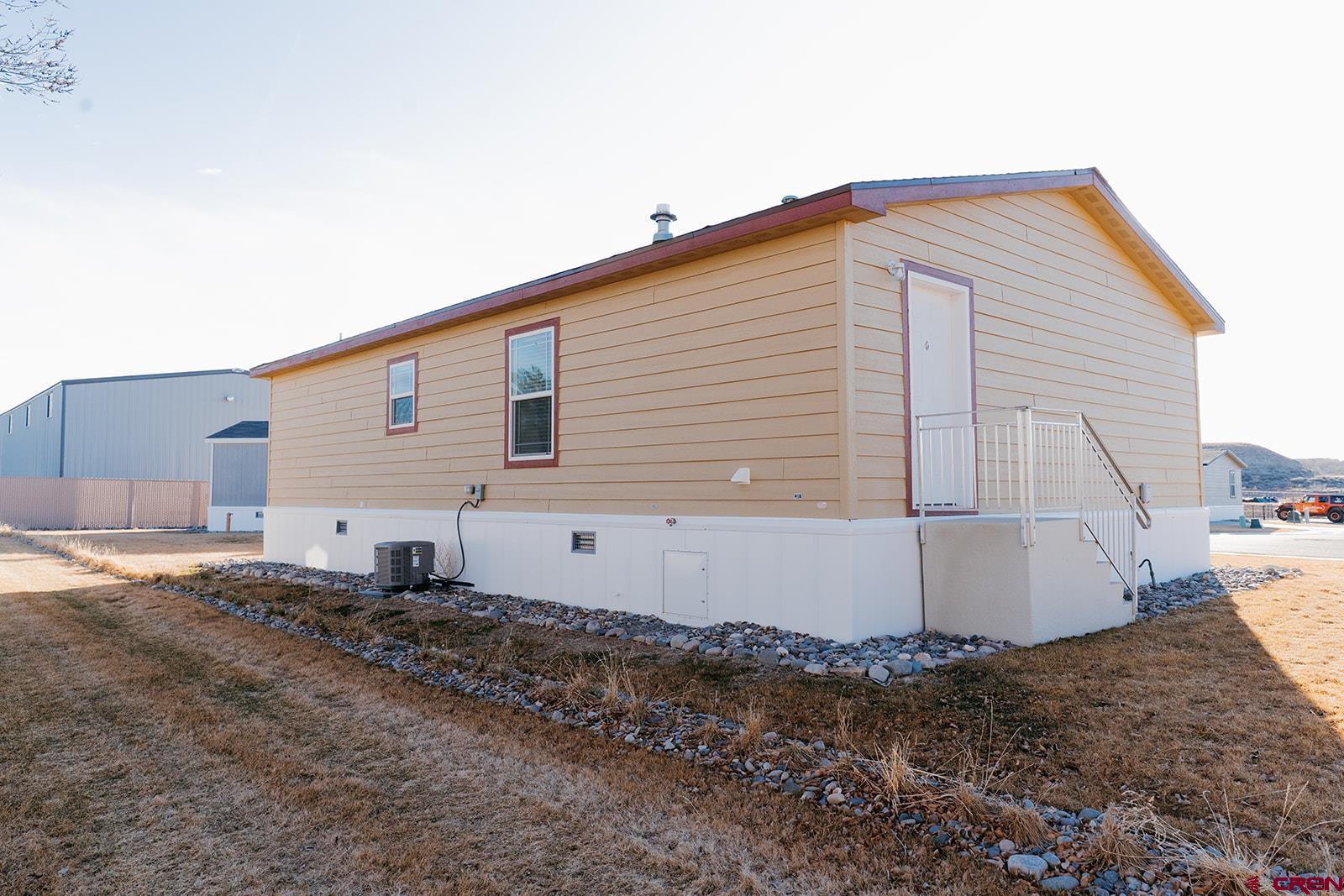 62650 Lasalle Road, Unit 820 Montrose, CO 81403 - Photo 3 of 29 a view of a house with a backyard