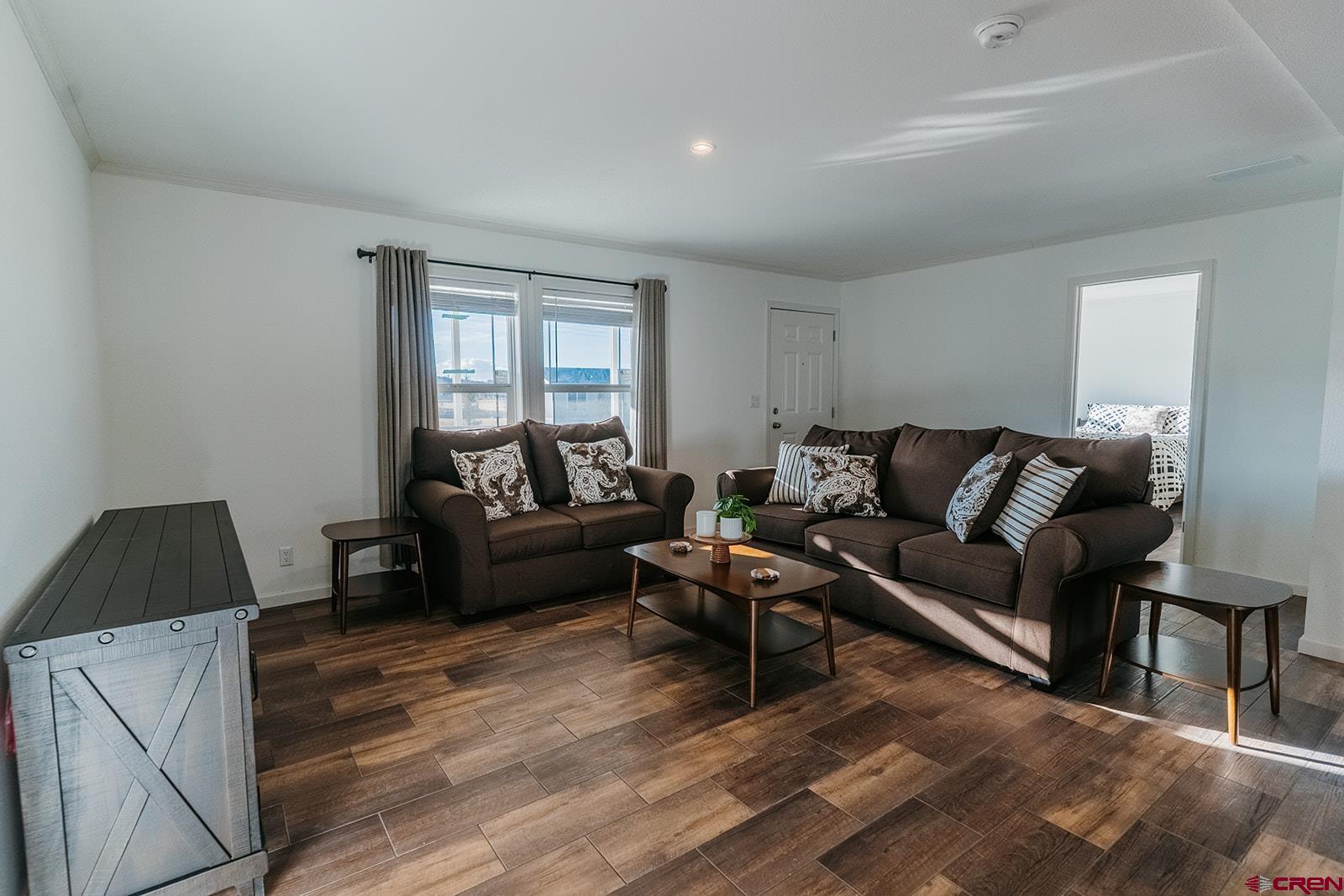 62650 Lasalle Road, Unit 820 Montrose, CO 81403 - Photo 10 of 29 a living room with furniture and a window