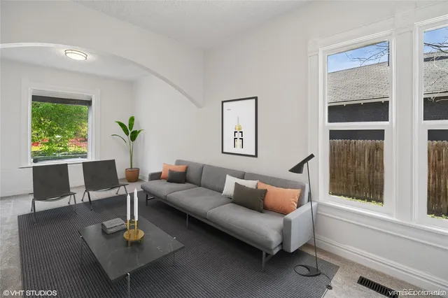 a living room with furniture and a window