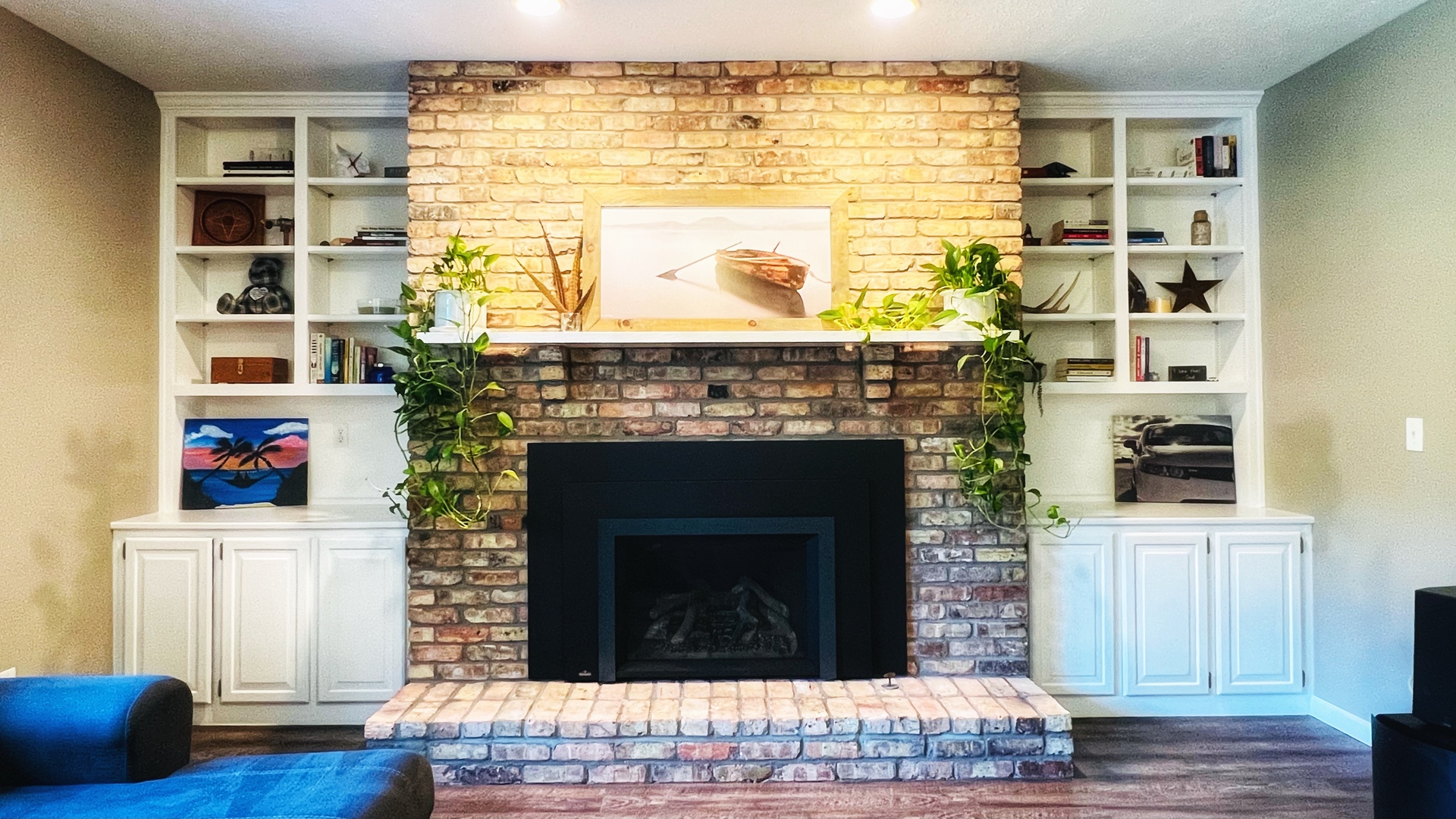 4 Downing Circle Bloomington, IL 61704 - Photo 23 of 69 a living room with a fireplace and a wooden floor