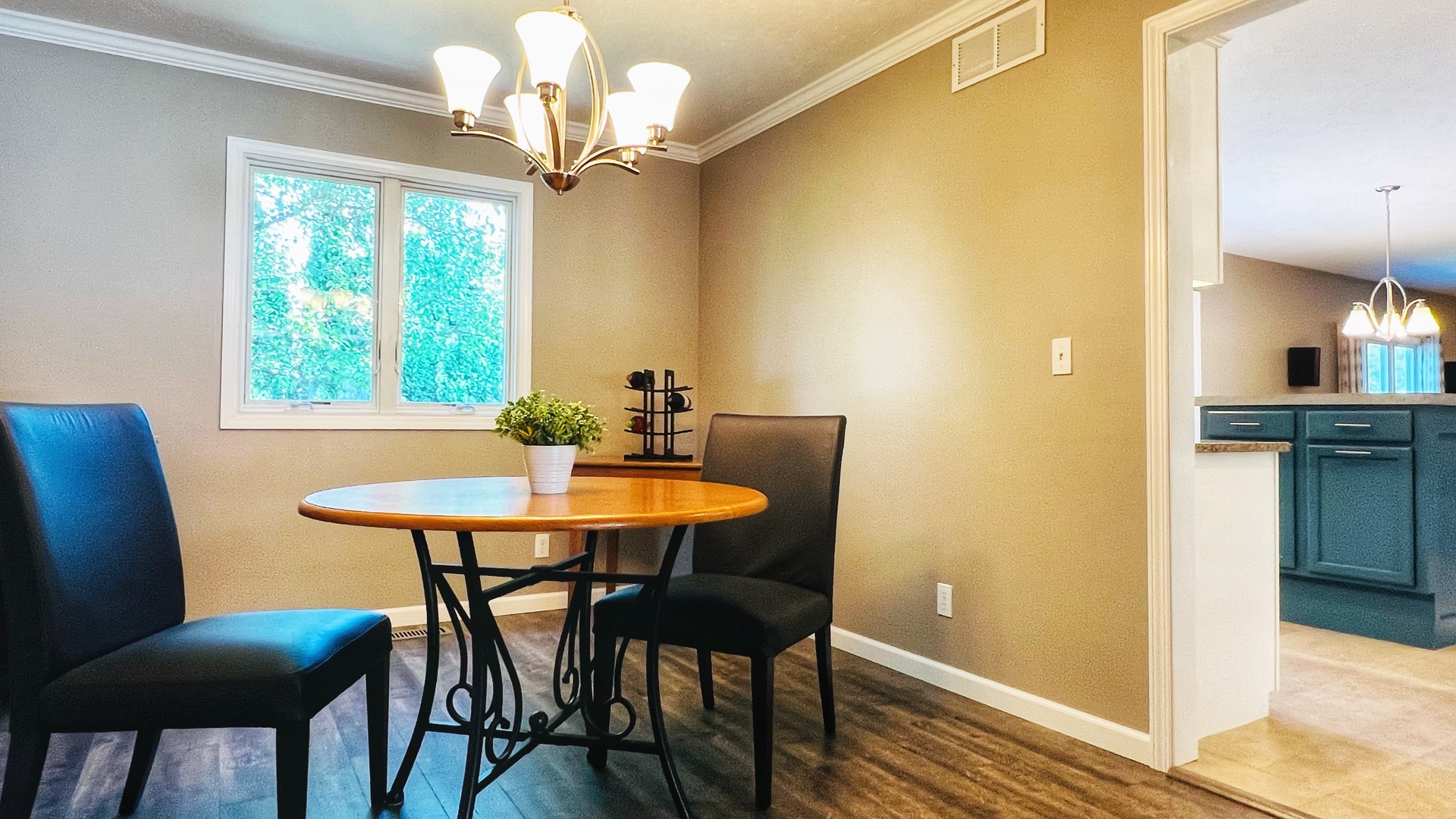 4 Downing Circle Bloomington, IL 61704 - Photo 27 of 69 a view of a dining room with furniture and a chandelier
