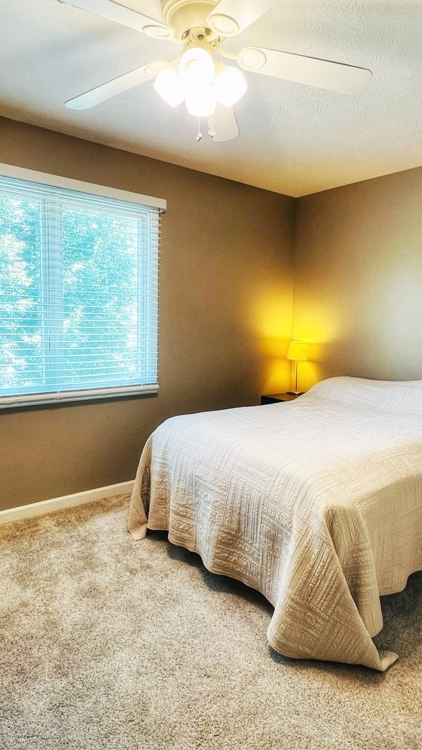 4 Downing Circle Bloomington, IL 61704 - Photo 46 of 69 a bedroom with a bed and lamp