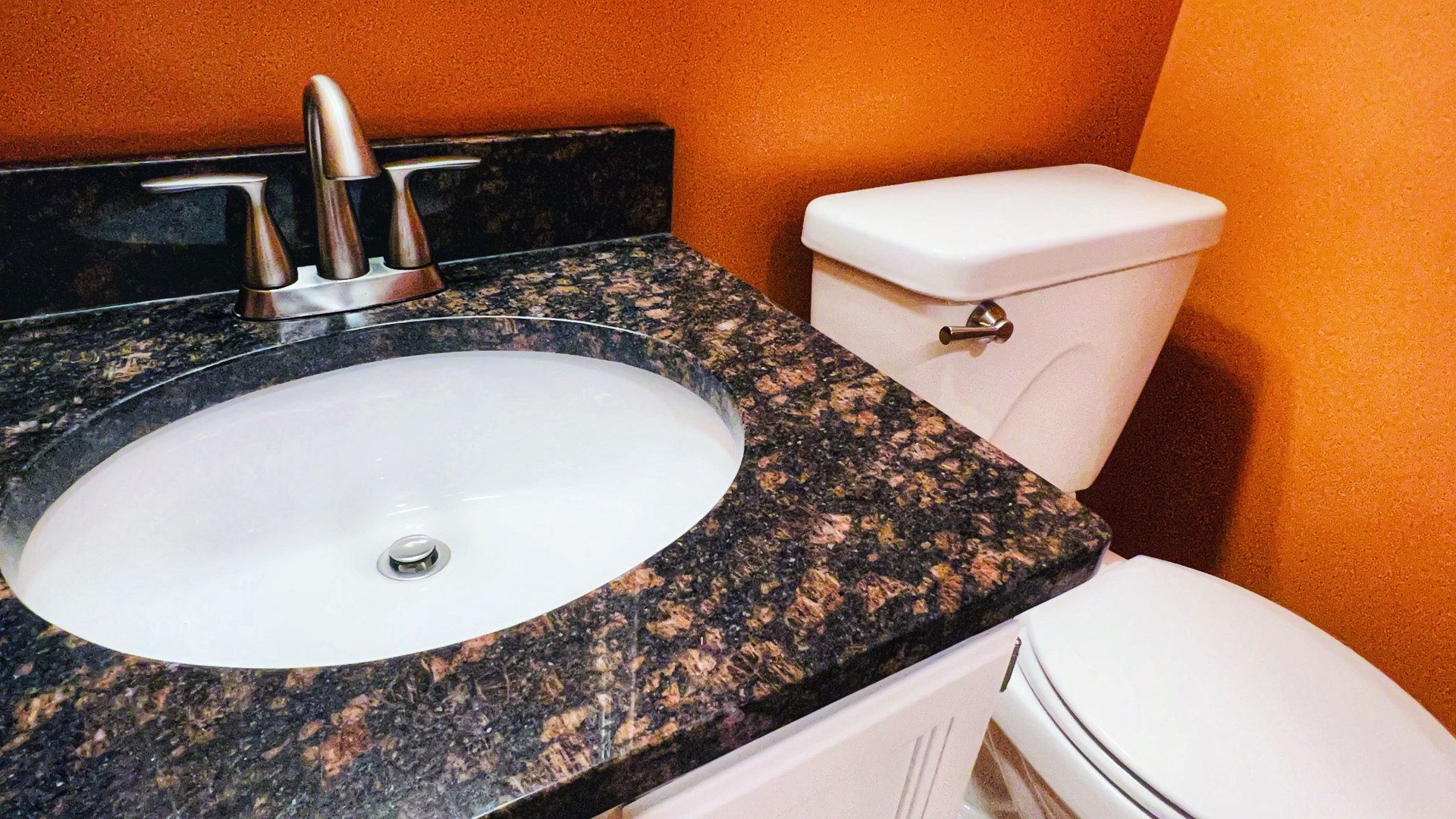 4 Downing Circle Bloomington, IL 61704 - Photo 55 of 69 a bathroom with a toilet sink and mirror