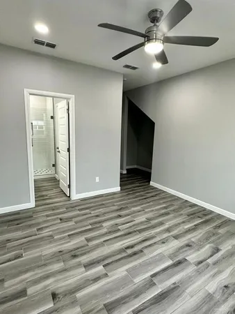 a kitchen with a sink a stove a refrigerator and cabinets