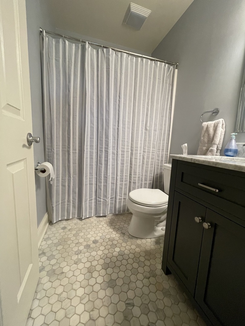 N742 Pleasant Hill Road Wheaton, IL 60187 - Photo 14 of 28 a bathroom with a sink toilet and shower