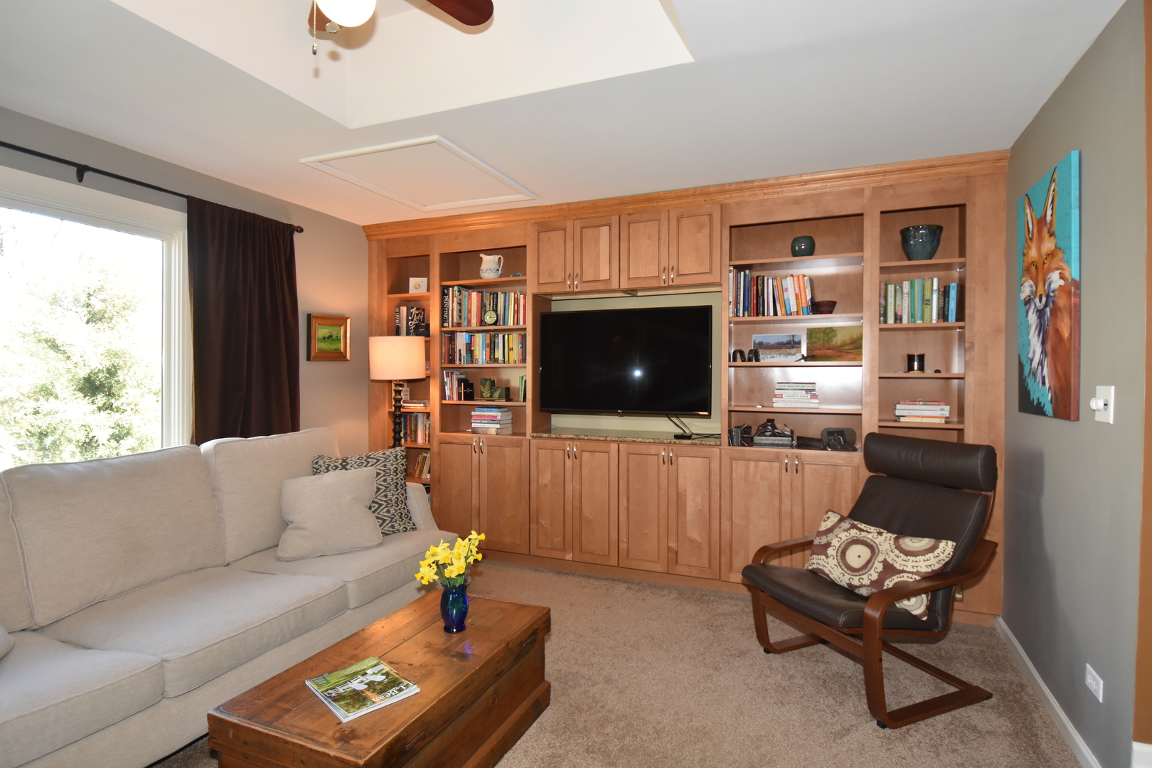 N742 Pleasant Hill Road Wheaton, IL 60187 - Photo 16 of 28 a living room with furniture and a flat screen tv