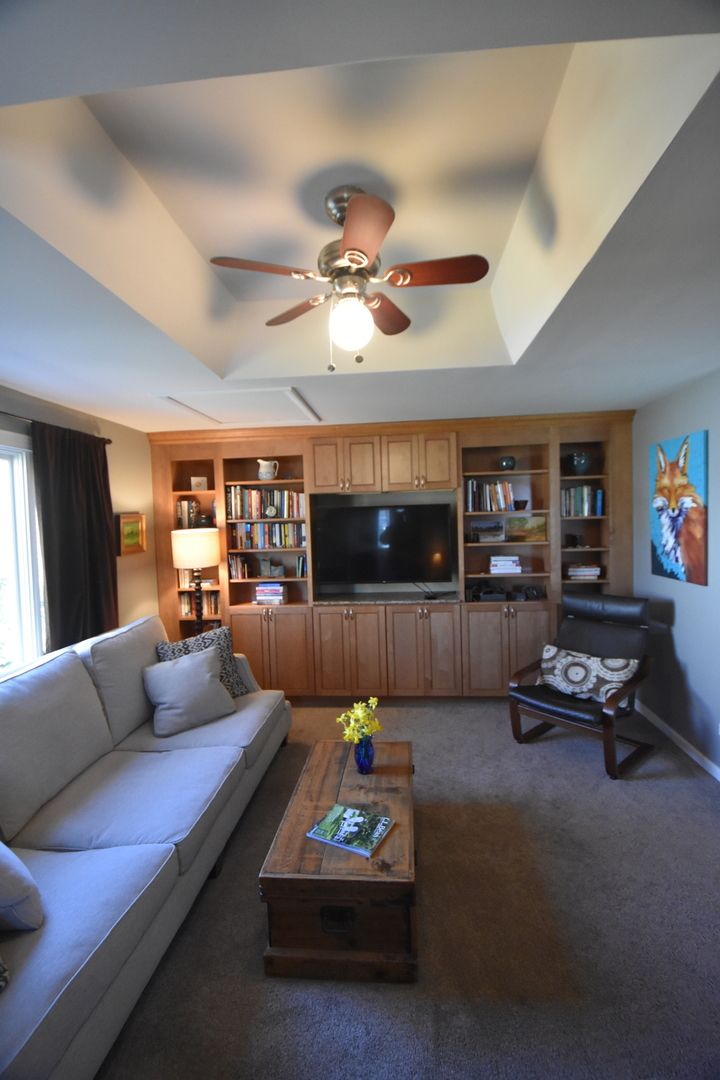 N742 Pleasant Hill Road Wheaton, IL 60187 - Photo 18 of 28 a living room with furniture a ceiling fan and a rug