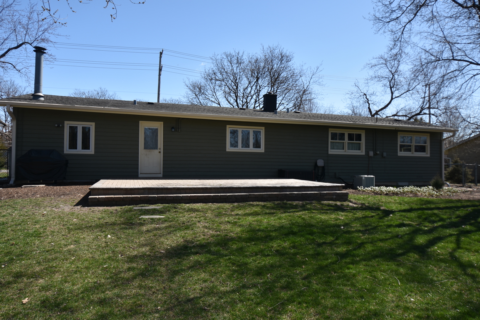 N742 Pleasant Hill Road Wheaton, IL 60187 - Photo 20 of 28 a front view of a house with a garden