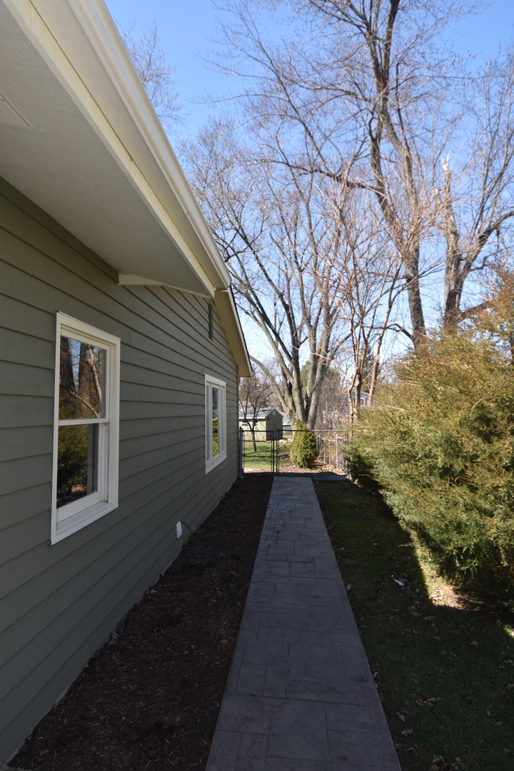 N742 Pleasant Hill Road Wheaton, IL 60187 - Photo 26 of 28 a view of a pathway both side of house
