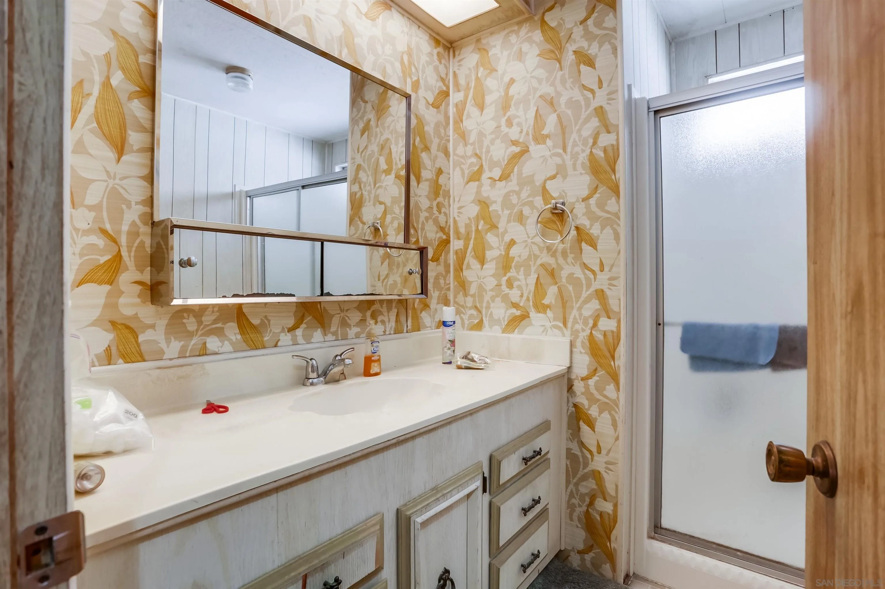 809 Olive Avenue, Unit 11 Vista, CA 92083 - Photo 12 of 26 a bathroom with a sink and a mirror