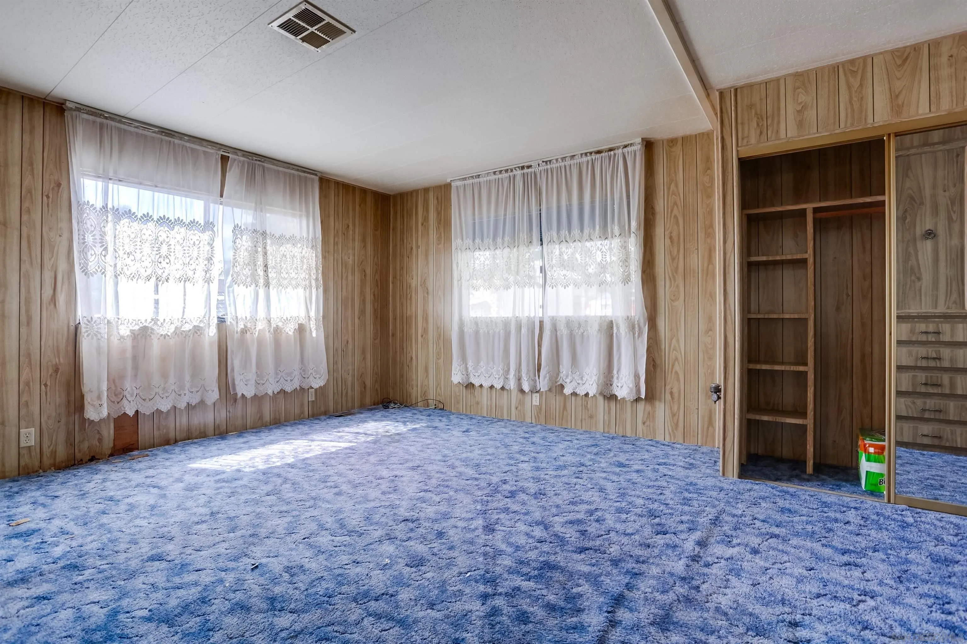 809 Olive Avenue, Unit 11 Vista, CA 92083 - Photo 13 of 26 an empty room with windows