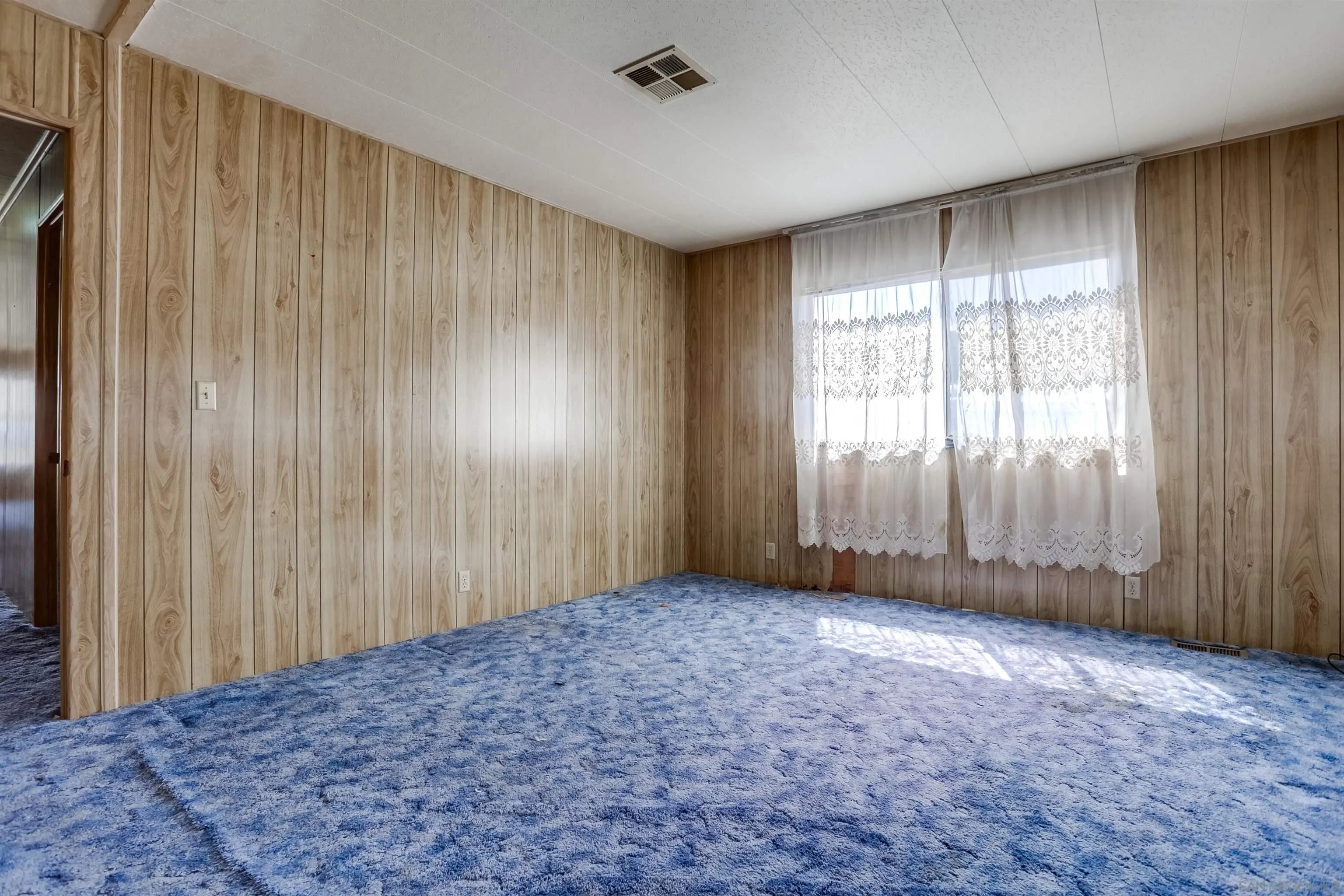 809 Olive Avenue, Unit 11 Vista, CA 92083 - Photo 14 of 26 an empty room with windows