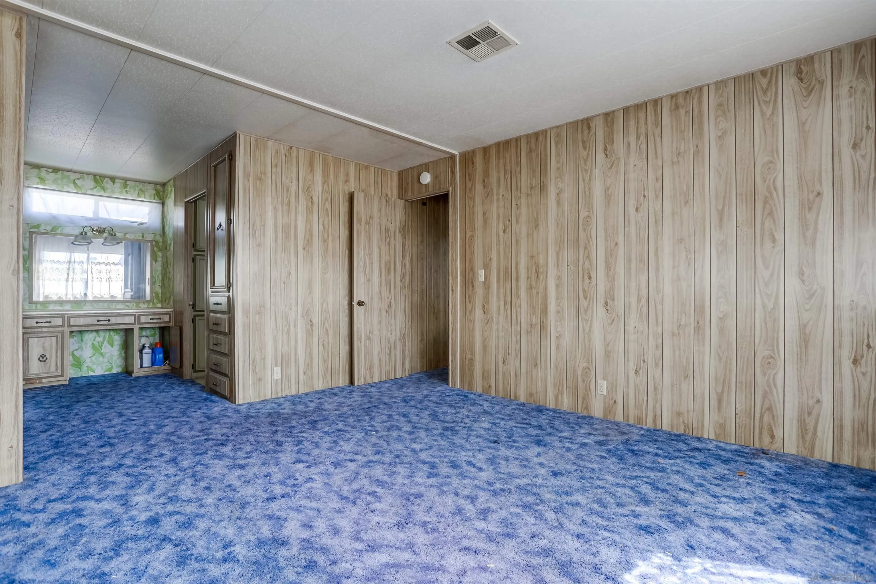809 Olive Avenue, Unit 11 Vista, CA 92083 - Photo 16 of 26 a view of a big room with windows and closet