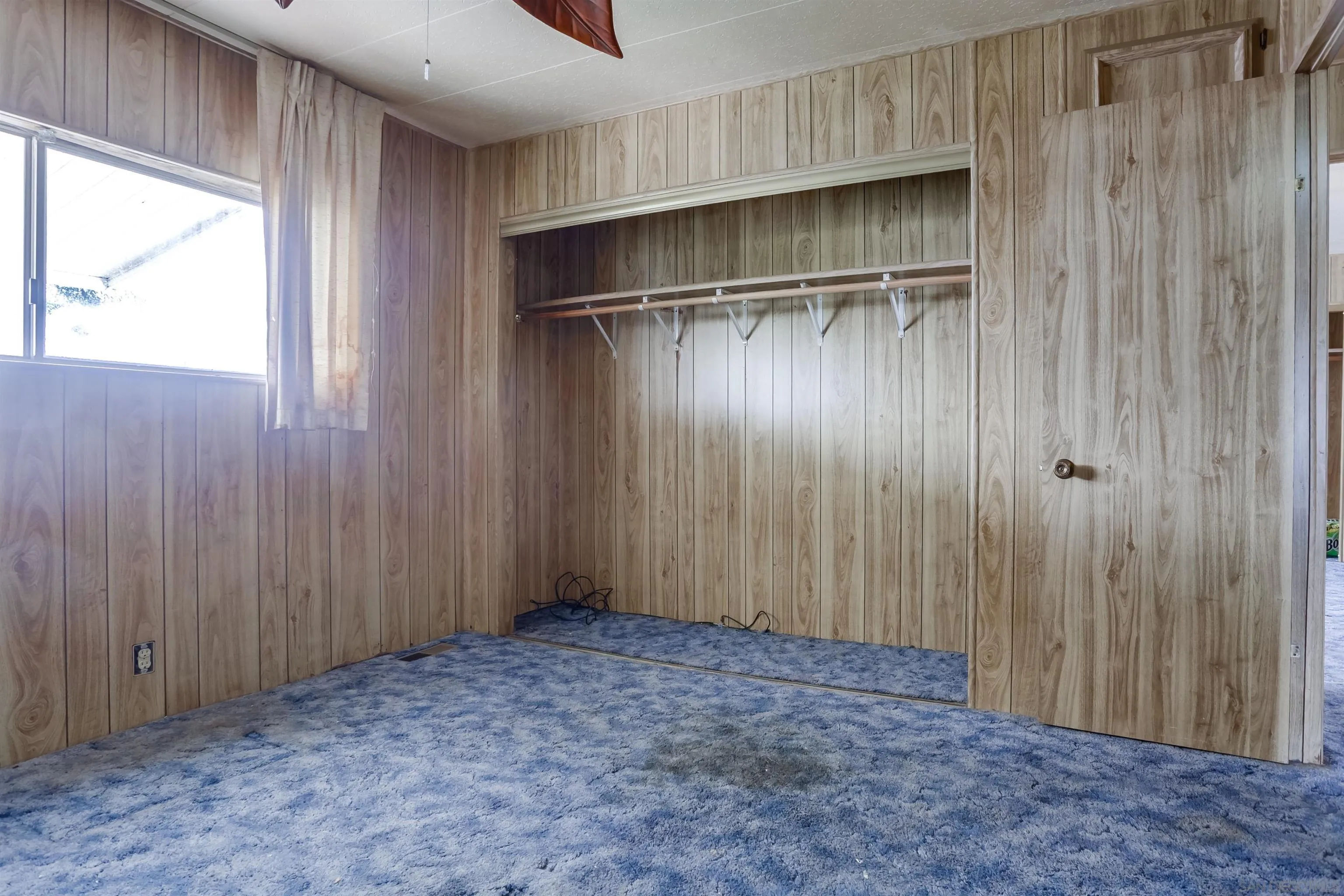 809 Olive Avenue, Unit 11 Vista, CA 92083 - Photo 20 of 26 a view of an empty room with a window