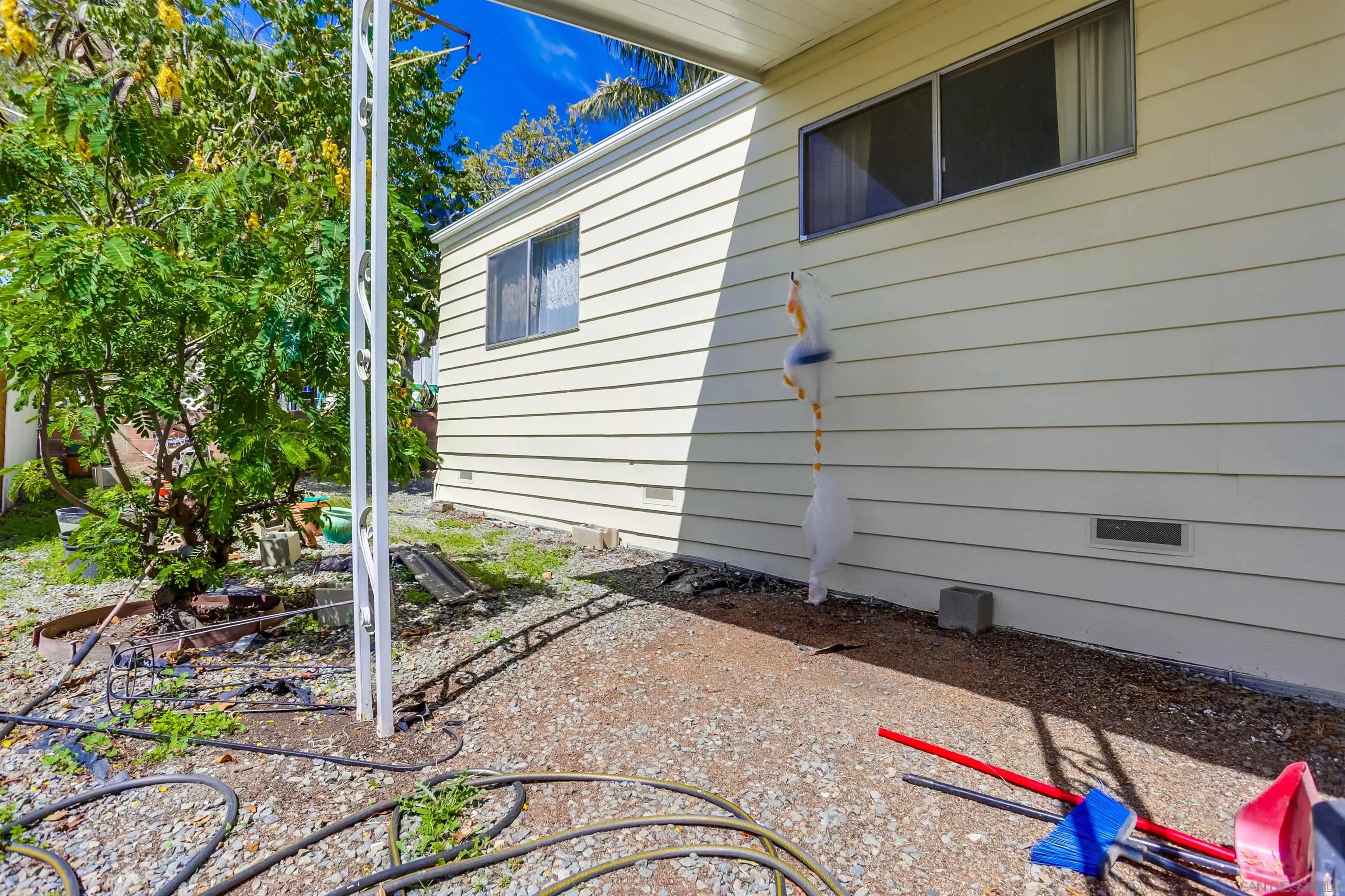 809 Olive Avenue, Unit 11 Vista, CA 92083 - Photo 21 of 26 a backyard of a house with seating space