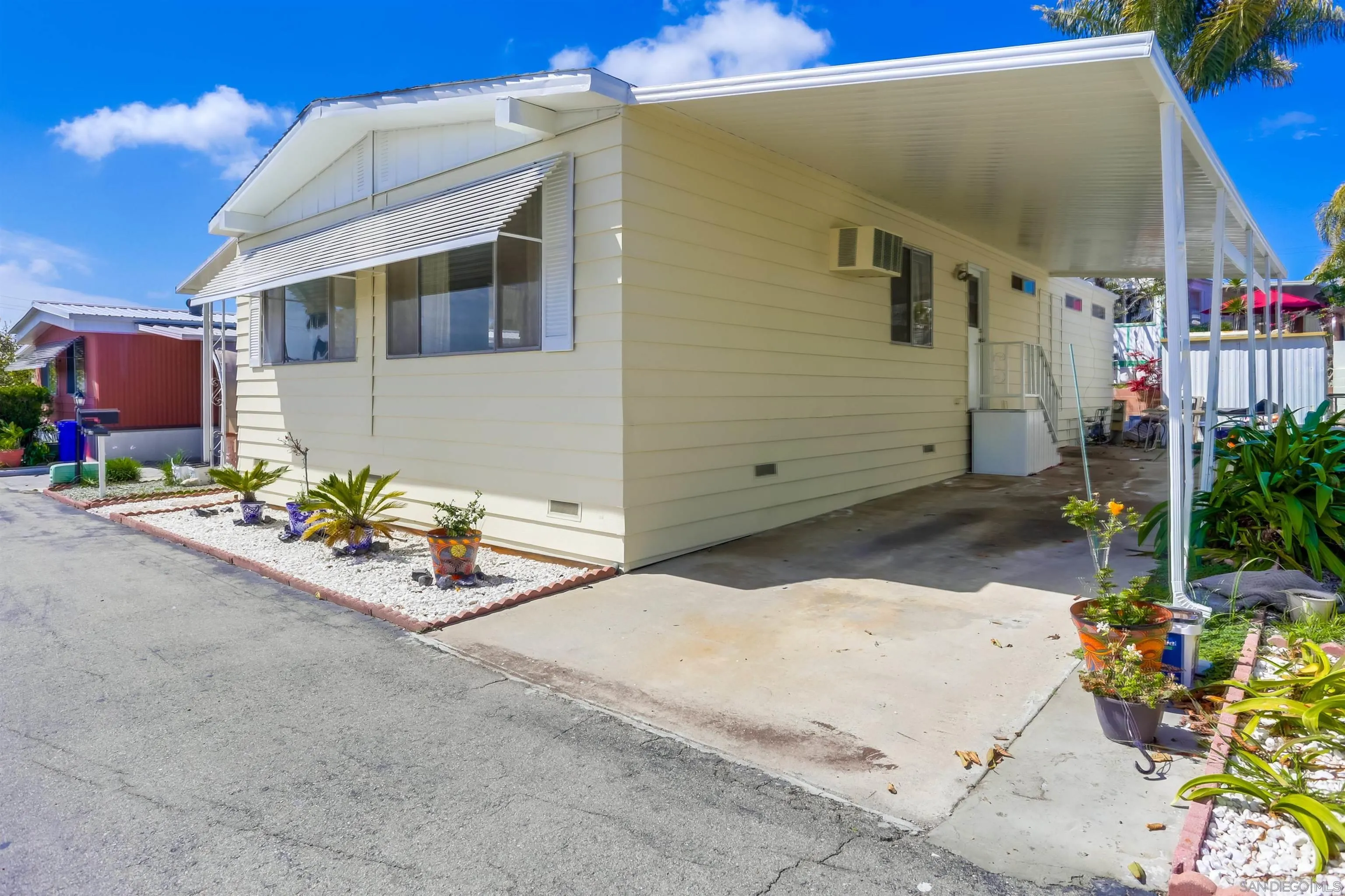 809 Olive Avenue, Unit 11 Vista, CA 92083 - Photo 3 of 26 a view of a patio with table and chairs and potted plants