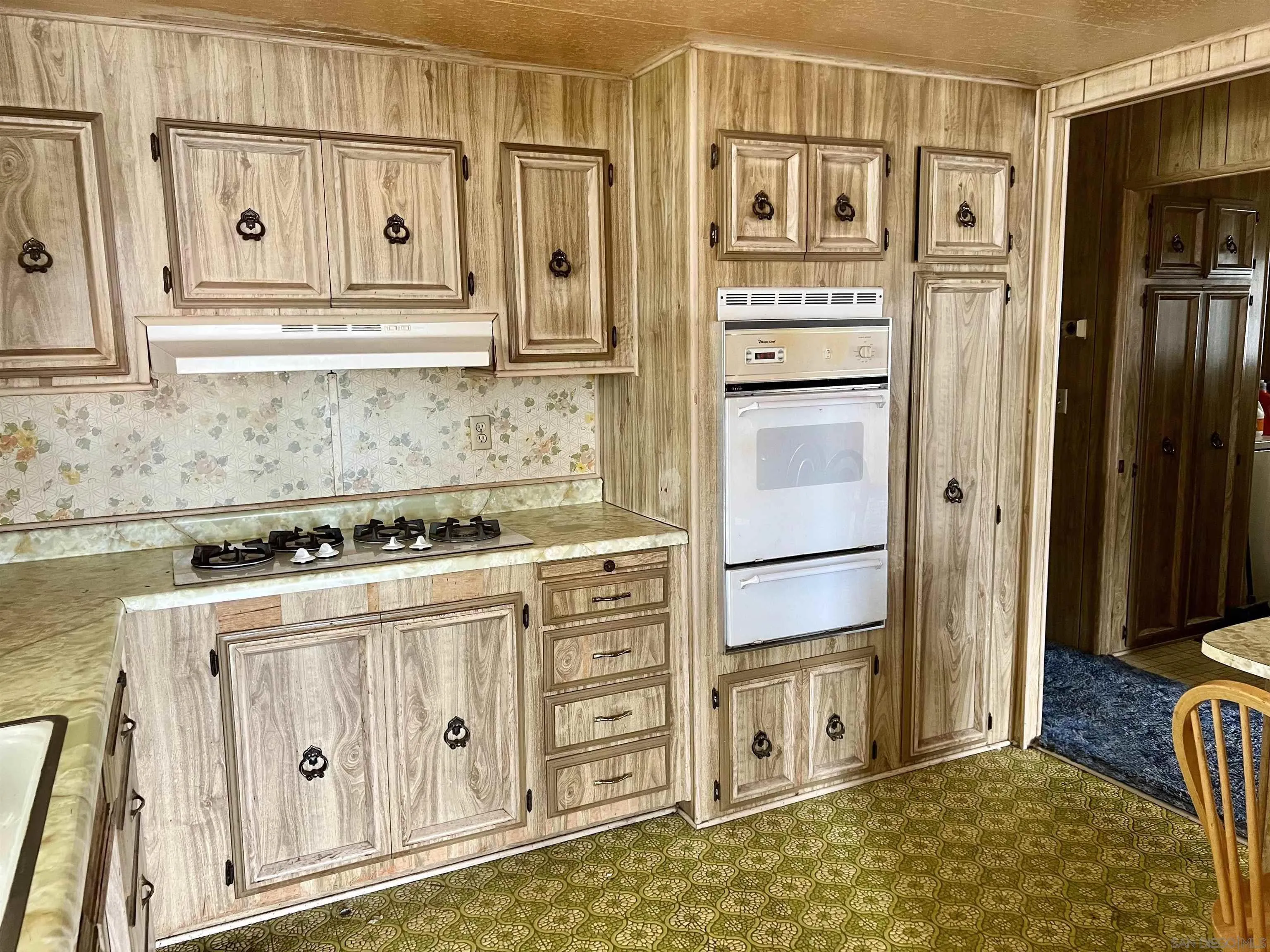 809 Olive Avenue, Unit 11 Vista, CA 92083 - Photo 9 of 26 a kitchen with stainless steel appliances granite countertop a refrigerator and a stove