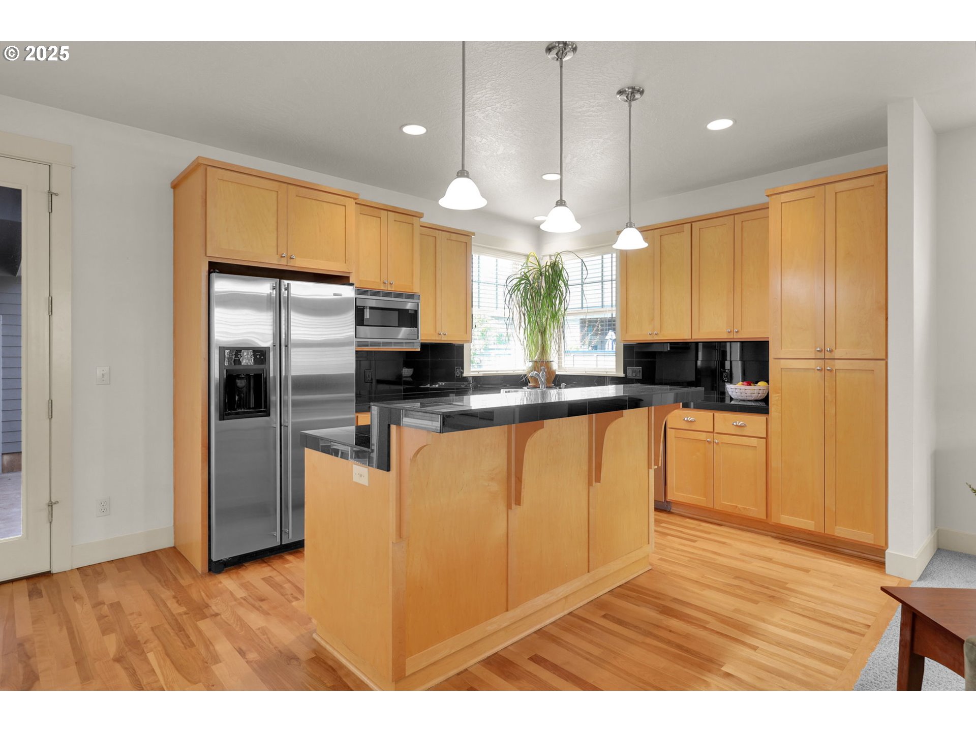 1260 Little John Lane Eugene, OR 97401 - Photo 14 of 44 a kitchen with stainless steel appliances kitchen island granite countertop a refrigerator a sink a stove and oven