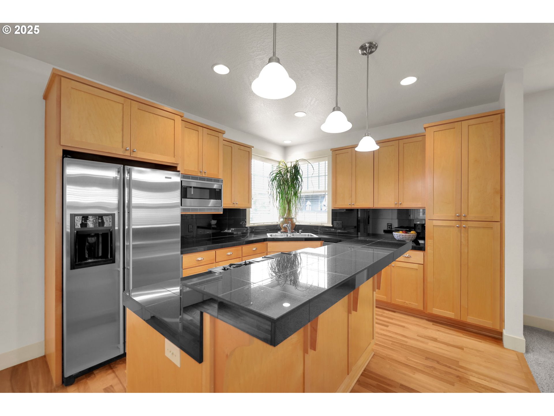 1260 Little John Lane Eugene, OR 97401 - Photo 15 of 44 a kitchen with stainless steel appliances granite countertop a sink a refrigerator and a stove