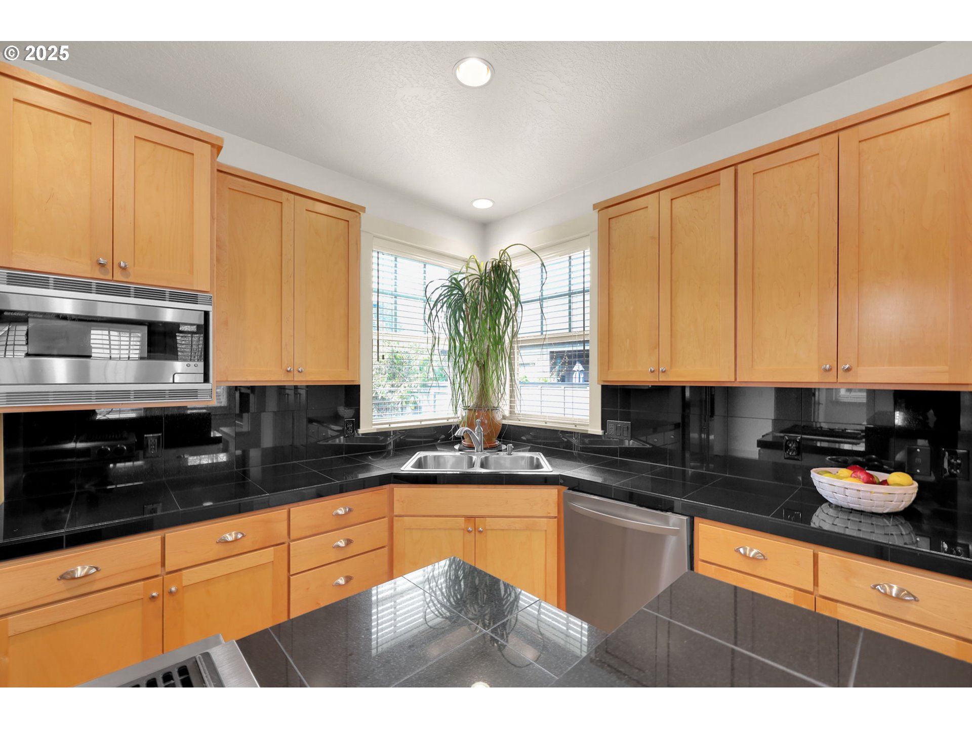 1260 Little John Lane Eugene, OR 97401 - Photo 16 of 44 a kitchen with granite countertop a sink a stove a counter space and cabinets