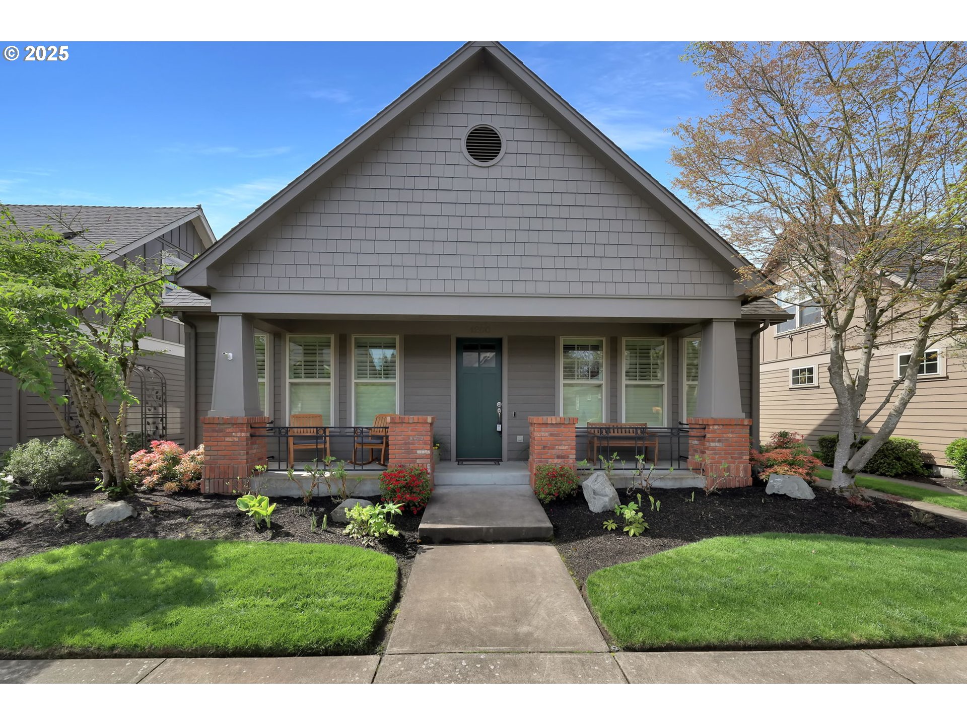 1260 Little John Lane Eugene, OR 97401 - Photo 2 of 44 a front view of house with a garden and patio