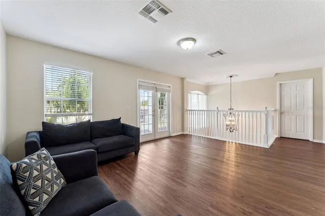a living room with furniture and windows