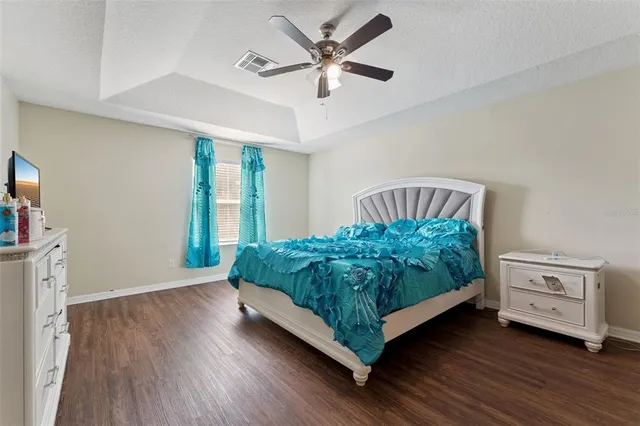 a bed room with a bed and a window