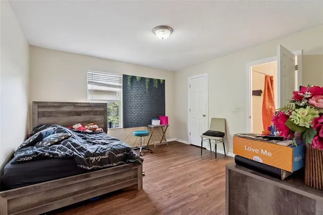 a bedroom with bed and a dresser